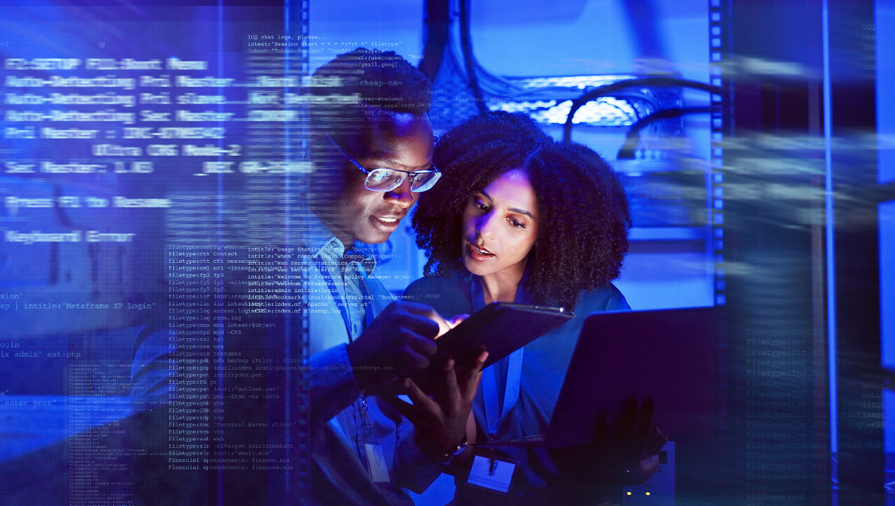 Man and Woman Checking Laptop and Tablet